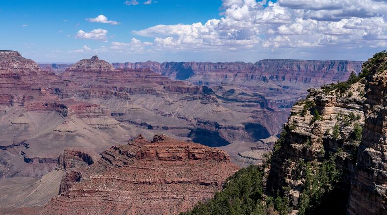 FILE - Clouds pass over the South Rim of Grand Canyon National Park in Grand Canyon Village, Ariz., Aug. 8, 2023. (AP Photo/Alex Brandon, File)