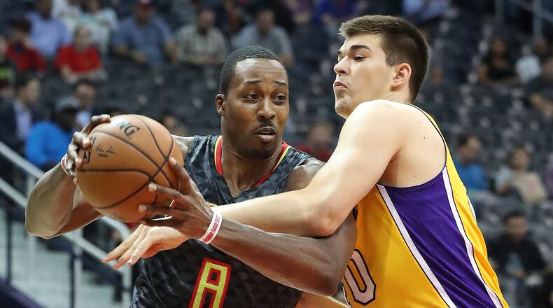Hawks’ Dwight Howard drives against Lakers’ Ivica Zubac during the first period in an NBA basketball game at Philips Arena on Wednesday, Nov. 2, 2016, in Atlanta. Curtis Compton /ccompton@ajc.com