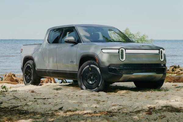 This photo provided by Rivian shows the R1T pickup truck, an electric truck that has multiple off-road modes and impressive towing capability. (Courtesy of Rivian via AP)