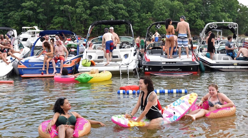 May 27, 2017 Buford - (Foreground from left) Ananya Banerjee, Mel Case and Darby Ford enjoy the fun and sun at Sunset Cove on Lake Lanier on Saturday, May 27, 2017. HYOSUB SHIN / HSHIN@AJC.COM