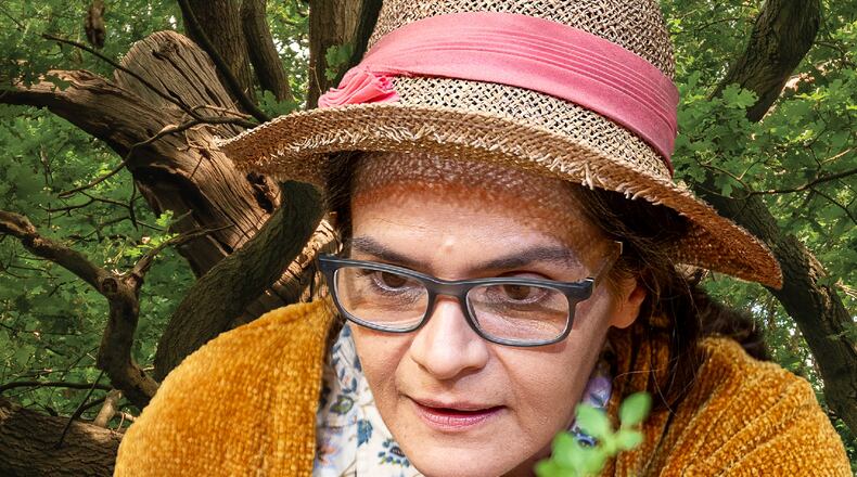 Maria Rodriguez-Sager plays Emery, a plant researcher who lives in a tree. One day, her YouTube followers begin showing up under her tree, chanting and singing. Photo: Shannel Resto