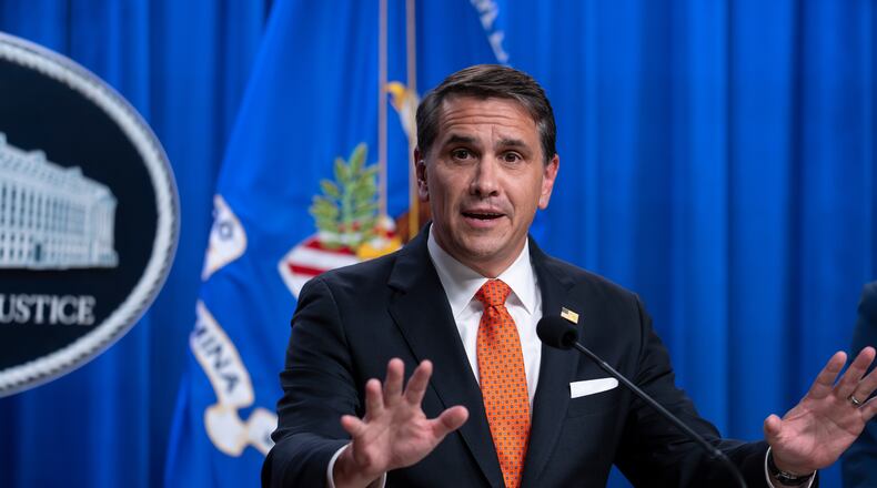 Acting Attorney General Todd Blanche speaks during a news conference regarding developments in the Trump Administration's anti-fraud efforts, at the Justice Department in Washington, Tuesday, April 7, 2026. (AP Photo/J. Scott Applewhite)