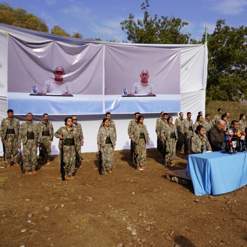 FILE - Kurdistan Workers' Party (PKK) fighters, who reportedly withdrew from Turkey with their weapons, stand to attention during a ceremony in the Qandil area of northern Iraq, щт Oct 26, 2025. (AP Photo/Rashid Yahya, File)