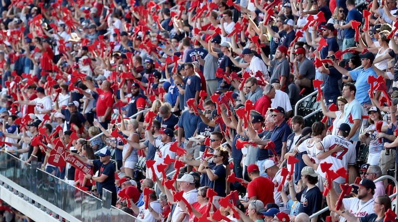 Atlanta Braves fans perform the tomahawk chop before the Atlanta Braves game against the St. Louis Cardinals in Game 1 at SunTrust Park Thursday, October 3, 2019 in Atlanta.