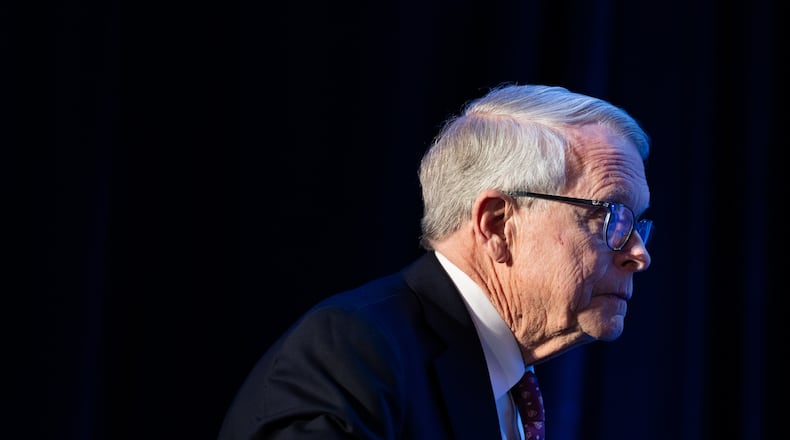 FILE - Gov. Mike DeWine, R-Ohio, arrives to an event at the National Governors Association Winter Meeting on Feb. 19, 2026, in Washington. (AP Photo/Allison Robbert, File)