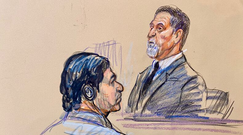FILE - This courtroom sketch depicts government witness Bruce Hoffman testifying as defendant Mohammad Sharifullah, seated left, listens during the opening day of the trial for Sharifullah in federal court in Alexandria, Va., April 20, 2026. (Dana Verkouteren via AP)