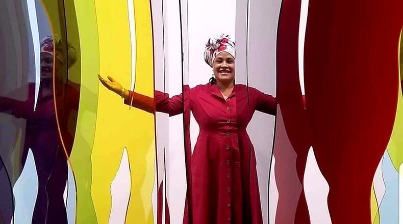 Hammonds House Museum has appointed Halima Taha, an arts professional, curator and author, artistic chair for the next three seasons. Taha is shown here with artwork by Tschabalala Self.