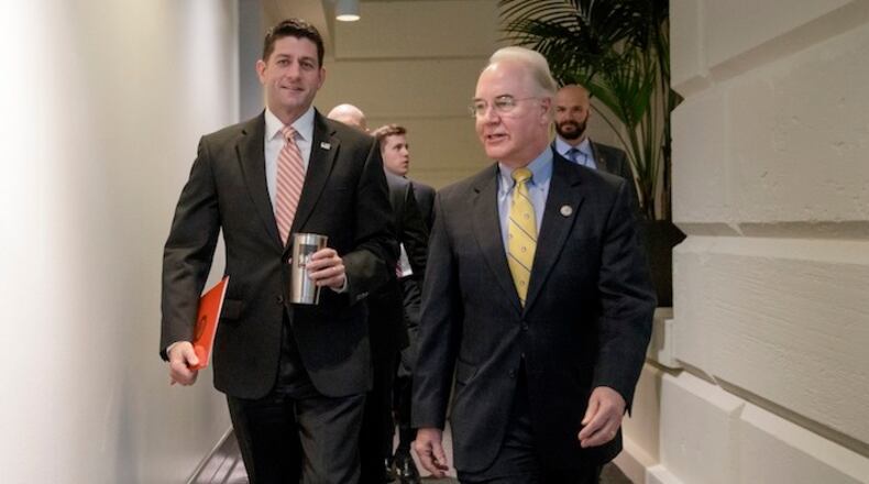 Speaker of the House Paul Ryan, R-Wis., arrives with Rep. Tom Price, R-Ga., President Donald Trump's nominee to be Secretary of Health and Human Services, for a closed-door GOP strategy session, on Capitol Hill in Washington, Tuesday, January 31, 2017. (AP Photo/J. Scott Applewhite)