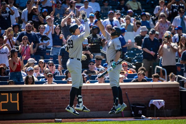 New York Yankees' Aaron Judge (99) celebrates his home run during a baseball game against the New York Mets, Friday, July 4, 2025, in New York. (AP Photo/Angelina Katsanis)