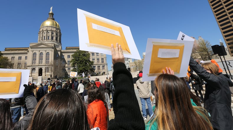 Students hold letters and signs to deliver to their representatives while attending a rally in Liberty Plaza at the Georgia Capitol after their school walkouts on Wednesday, March 14, 2018, in Atlanta. At the conclusion of the rally many went inside to meet with their state representatives. Curtis Compton/ccompton@ajc.com