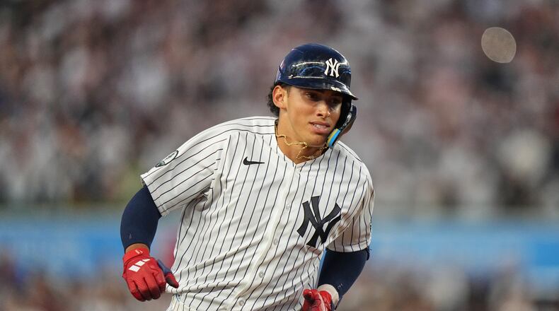 New York Yankees' George Lombard Jr. runs the bases after hitting a home run during the fifth inning of a baseball game against the St. Louis Cardinals Tuesday, Aug. 4, 2026, in New York. (AP Photo/Frank Franklin II)