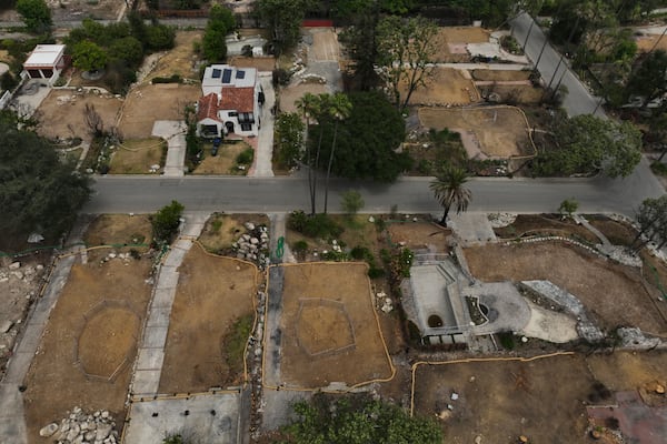 Lots sit empty after the homes were destroyed in the Eaton Fire in Altadena, Calif., Wednesday, June 4, 2025. (AP Photo/Jae C. Hong)