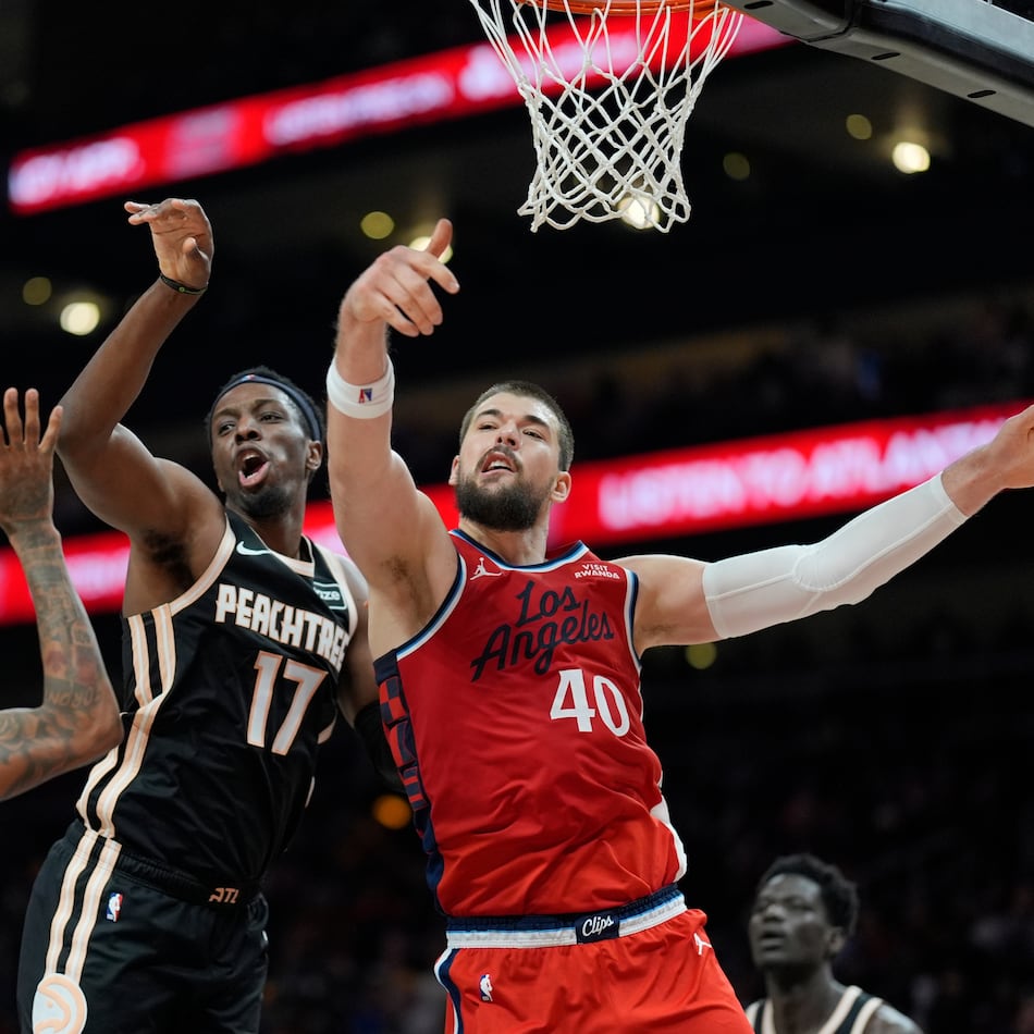 Los Angeles Clippers center Ivica Zubac (40) and Atlanta Hawks forward Onyeka Okongwu (17) vie for a loose ball during the first half of an NBA basketball game, Wednesday, Dec. 3, 2025, in Atlanta. (Mike Stewart/AP)