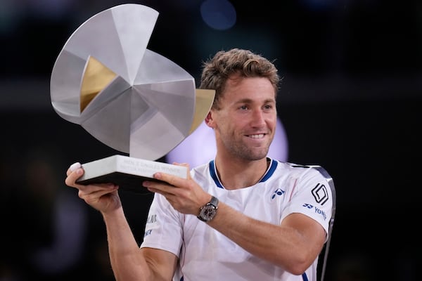 Norway's Casper Ruud holds the trophy after winning the Madrid Open tennis final in Madrid, Spain, Sunday, May 4, 2025. (AP Photo/Manu Fernandez)