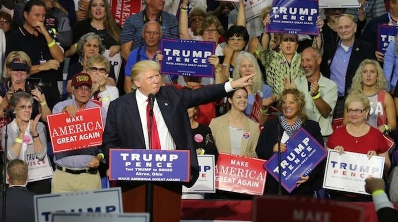 Republican candidate Donald Trump acknowledges supporters still filing into the University of Akron's James A. Rhodes Arena on Monday, Aug. 22, 2016, in Akron, Ohio. (Phil Masturzo/Akron Beacon Journal/TNS)