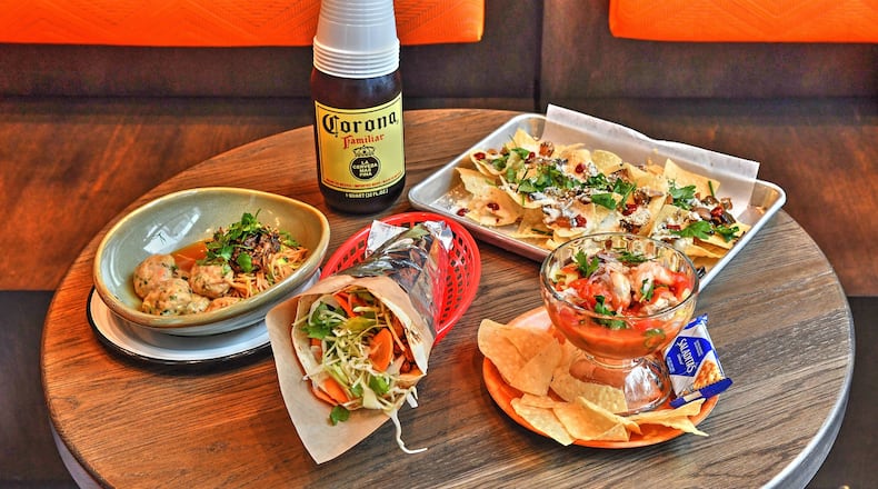 From left: Shrimp Sopa Seca Bowl, El Burro Pollo Burrito, Vuelve A La Vida (lower right) and Macho Nachos (upper right). CONTRIBUTED BY CHRIS HUNT PHOTOGRAPHY