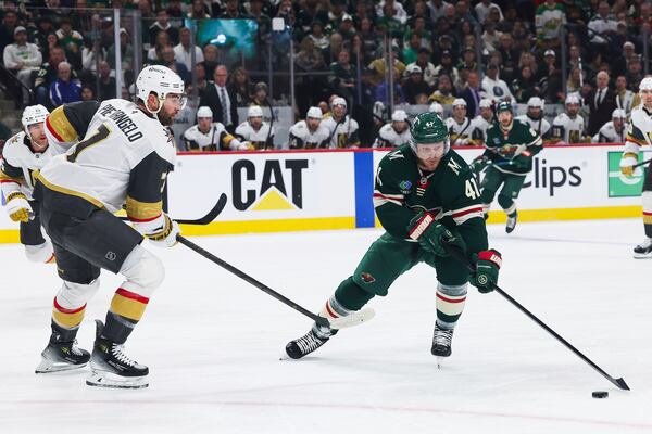 Minnesota Wild center Gustav Nyquist (41) handles the puck against Vegas Golden Knights defenseman Alex Pietrangelo (7) during the first period in Game 4 of an NHL hockey Stanley Cup first-round playoff series, Saturday, April 26, 2025, in St. Paul, Minn. (AP Photo/Stacy Bengs)