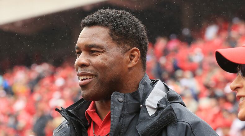 Former Georgia running back Herschel Walker in on the sidelines for the football game against Alabama on Saturday, Oct. 3, 2015, in Athens. (AJC/Curtis Compton)
