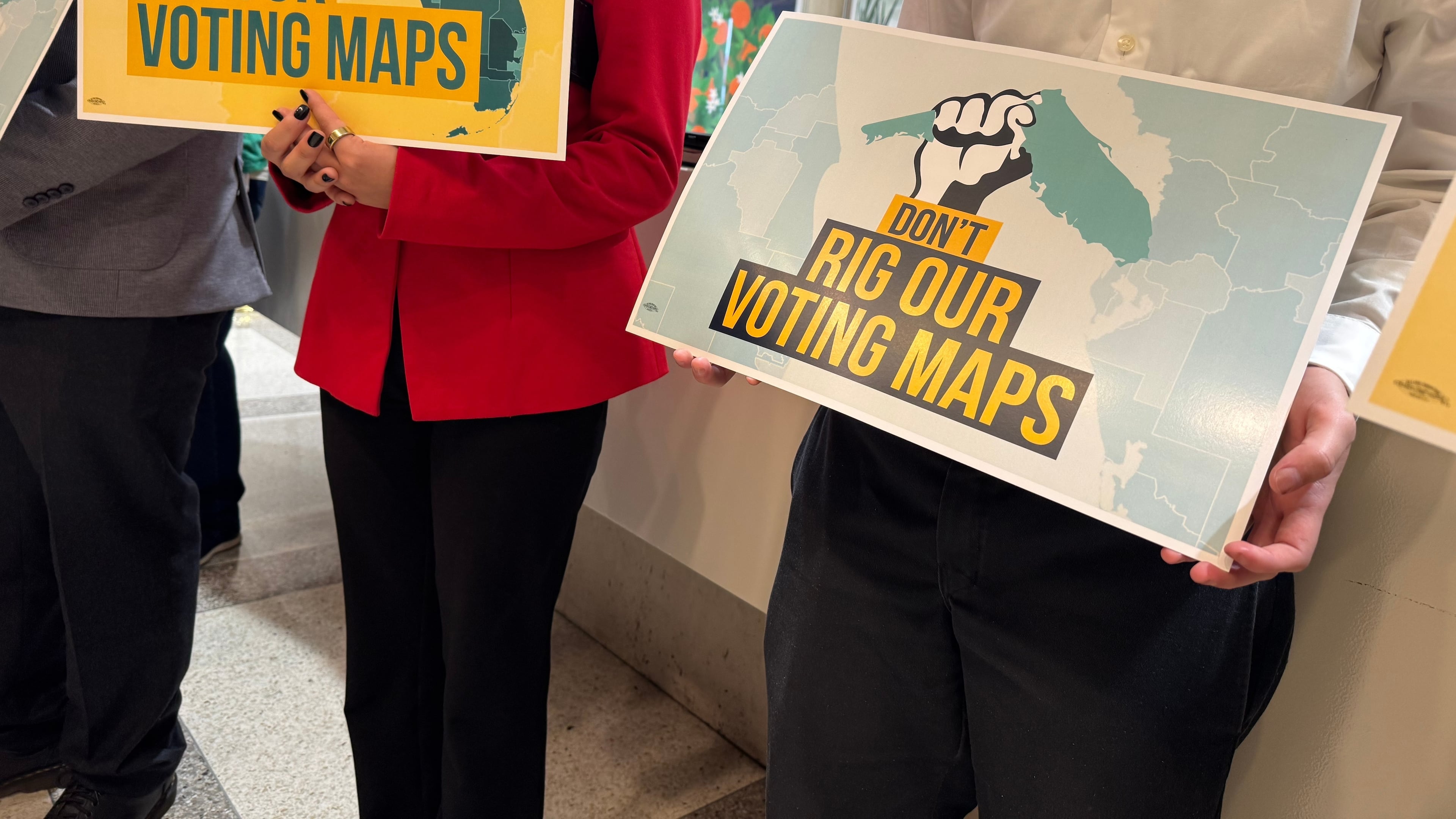 Opponents of mid-decade efforts to redraw congressional voting districts gather to protest in the Florida Capitol in Tallahassee, Fla., Dec. 2, 2025. (AP Photo/Kate Payne)