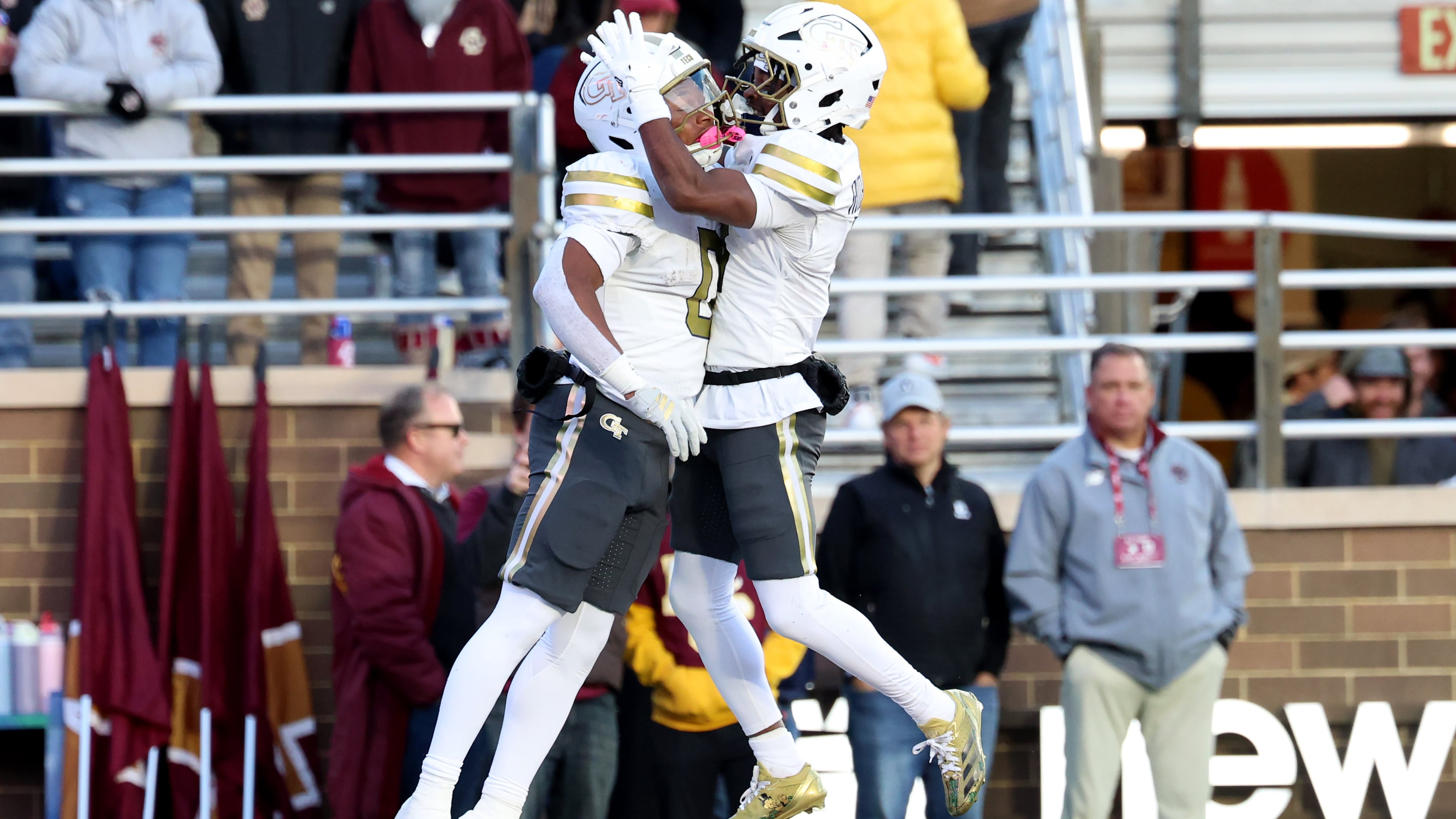 Georgia Tech running back Malachi Hosley (left) ran for 107 yards and a touchdown, while wide receiver Malik Rutherford (right) had 121 yards receiving. Georgia Tech narrowly escaped a Boston College upset bid with a 36-34 win. (Mark Stockwell/AP)