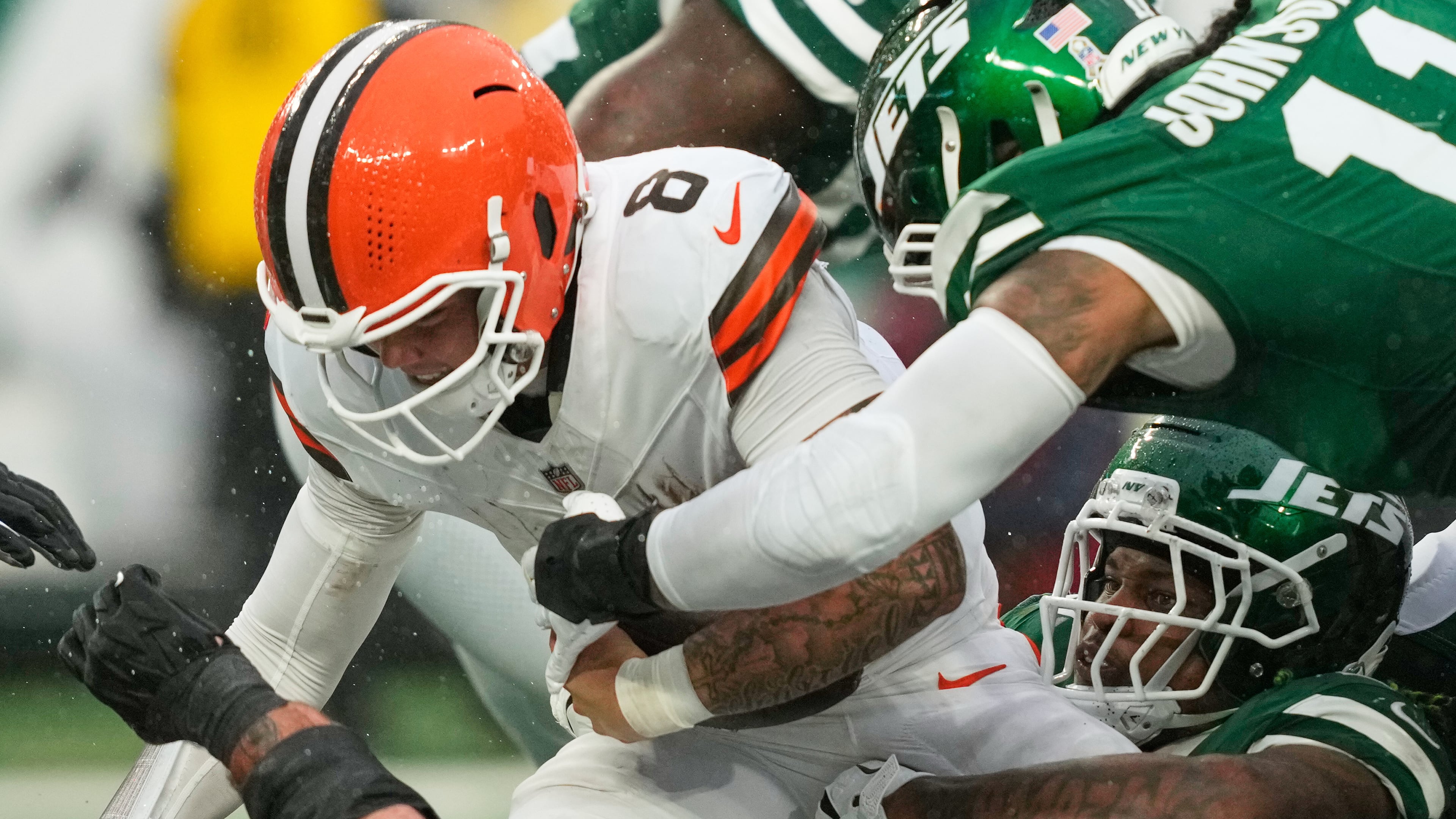 Cleveland Browns quarterback Dillon Gabriel (8) is sacked by New York Jets linebacker Quincy Williams, bottom right, in the second half of an NFL football game Sunday, Nov. 9, 2025, in East Rutherford, N.J. (AP Photo/Yuki Iwamura)