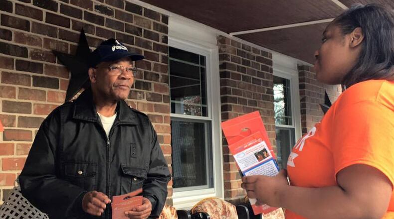 Mary-Pat Hector speaks to a potential voter. (Photo from Facebook)