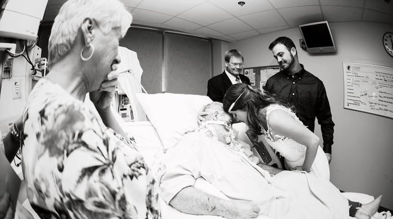 A couple moved their wedding to a hospital room so the bride’s father could attend. (Credit: Julie York Schandolph)