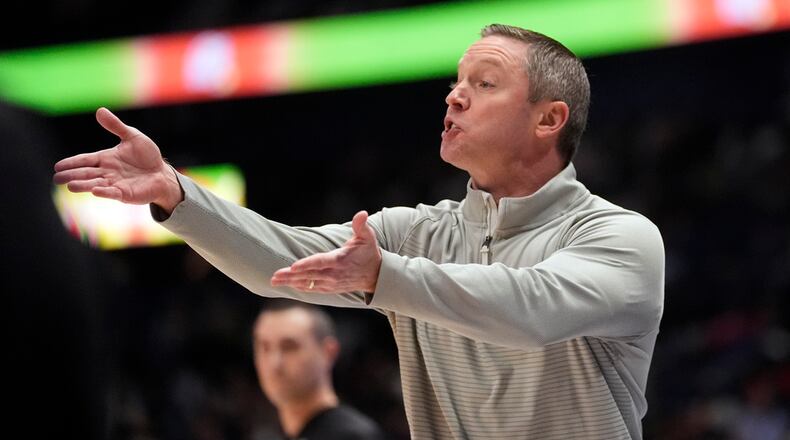 Georgia head coach Mike White reacts on the sideline during the first half of an NCAA college basketball game against Missouri at the Sotheastern Conference tournament Wednesday, March 13, 2024, in Nashville, Tenn. (AP Photo/John Bazemore)