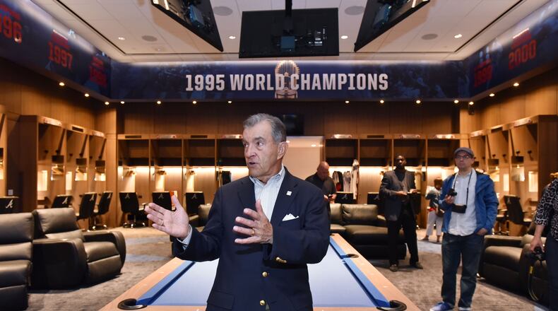 John Schuerholz,  the Braves’ general manager from October 1990 through the 2007 season, visits the home clubhouse at  SunTrust Park (now Truist Park) in 2017.  The Braves’ 1995 World Series championship is prominently commemorated in the clubhouse.