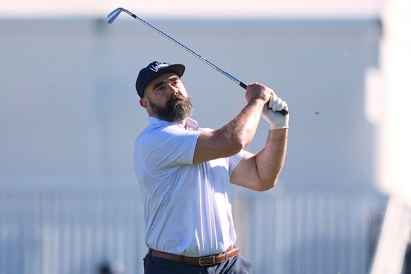Former Philadelphia Eagles football player Jason Kelce watches his shot on the 16th hole during a pro-am before the Truist Championship golf tournament at the Philadelphia Cricket Club, Wednesday, May 7, 2025, in Flourtown, Pa. (AP Photo/Matt Rourke)