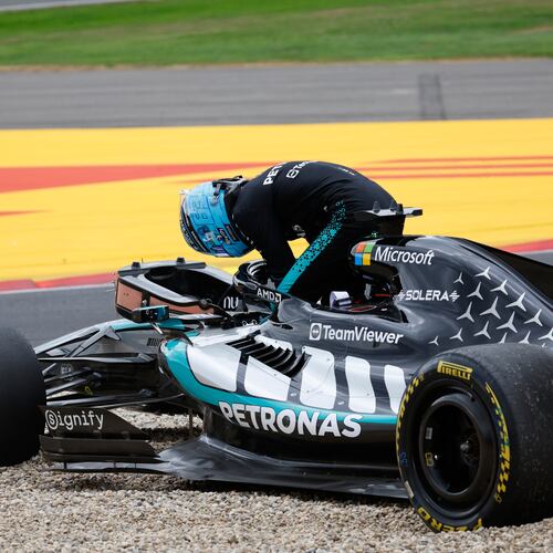 Mercedes driver George Russell of Britain gets out of his car after going off the track during the Formula One Grand Prix at the Spa-Francorchamps racetrack in Spa, Belgium, Sunday, July 19, 2026. (AP Photo/Geert Vanden Wijngaert)