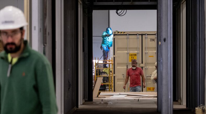 200417-Lawrenceville-Workers with BMarko Structures fabricate modular hospital rooms out of shipping containers Friday morning April 17, 2020 at a facility in Lawrenceville. After coming up with a design for the modular rooms, the company hired 70 workers, rented a workspace, built and shipped a 24-bed modular hospital to Albany in just two weeks. They are continuing to build more units for other hospitals around Georgia through the Georgia Emergency Management Agency. Ben@BenGray.com for the Atlanta Journal-Constitution