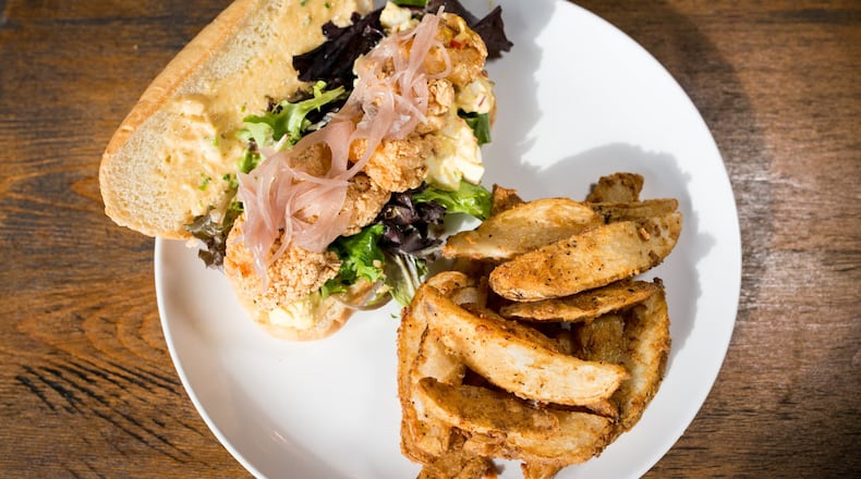 Deviled Egg Po Boy with fried shrimp, farm egg salad, creole remoulade, veggies and Twisted house fries at Twisted Soul. / Photo credit- Mia Yakel.