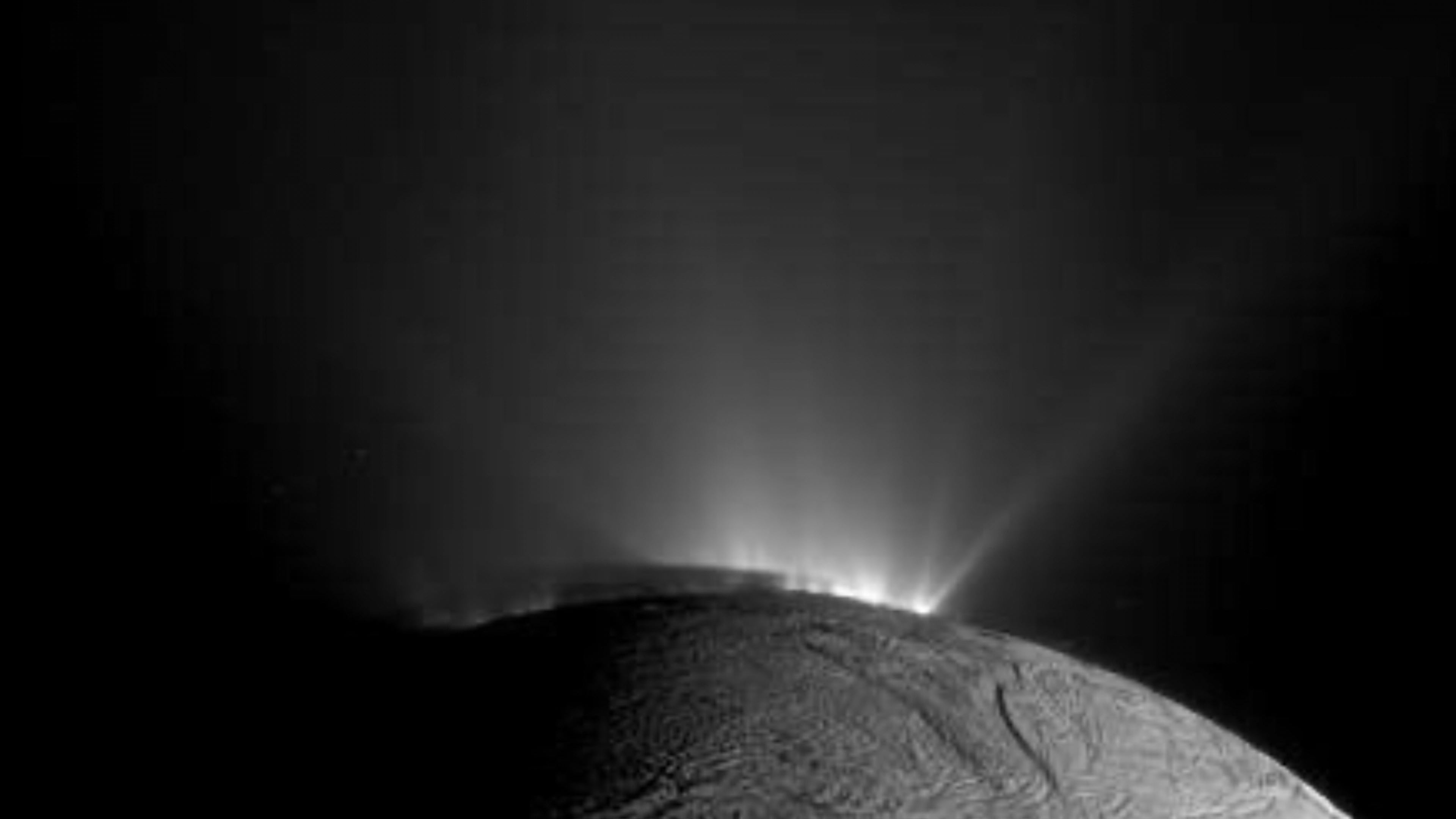 In this image provided by NASA, NASA’s Cassini spacecraft captured this image of Enceladus on Nov. 30, 2010, with the shadow of the body of Enceladus on the lower portions of the jets is clearly visible. (NASA/JPL-Caltech/Space Science Institute via AP)
