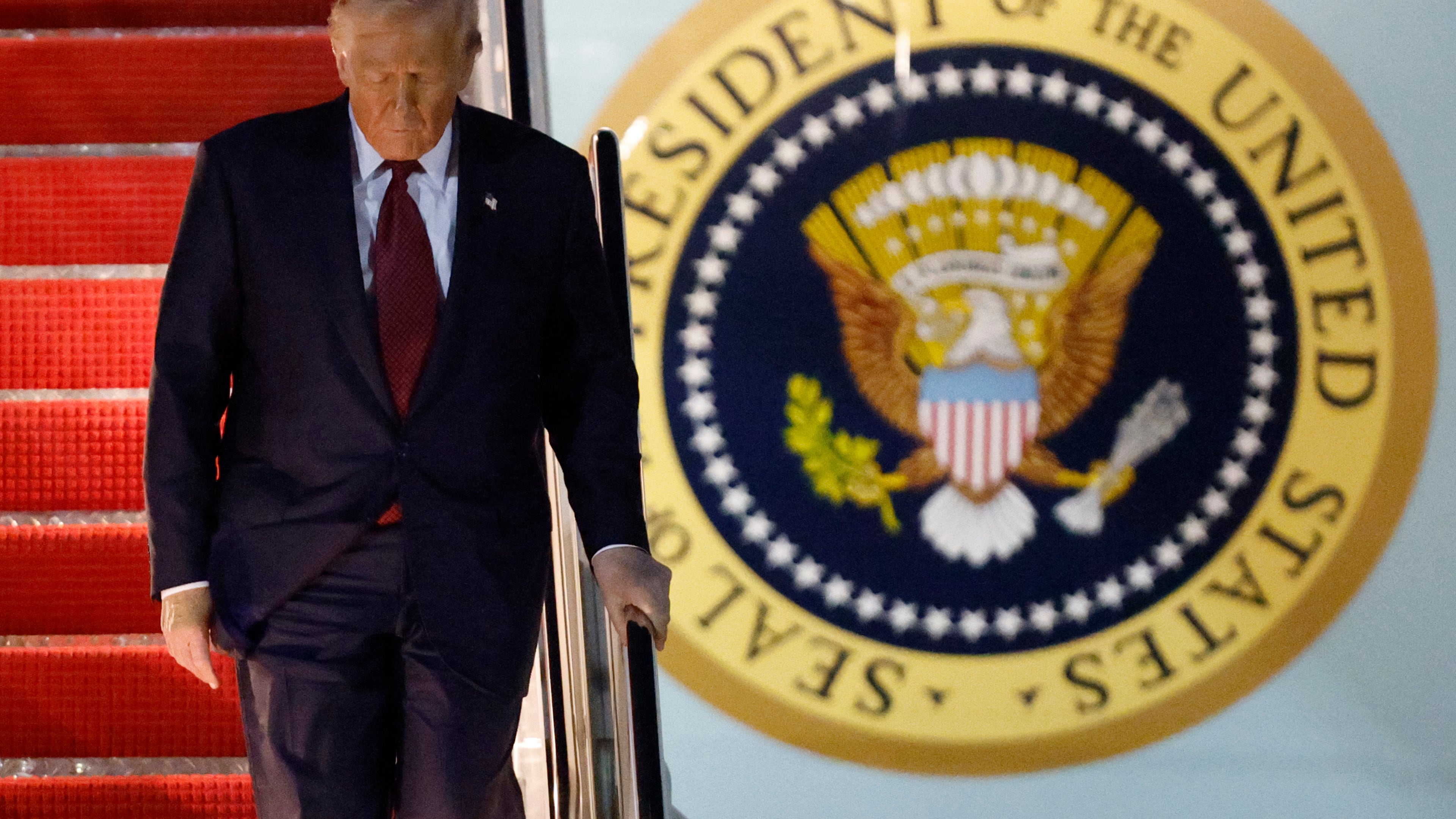 President Donald Trump walks down the stairs of Air Force One upon his arrival at Joint Base Andrews, Md., Wednesday, Nov. 5, 2025, after giving a speech at the American Business Forum in Miami. (AP Photo/Luis M. Alvarez)