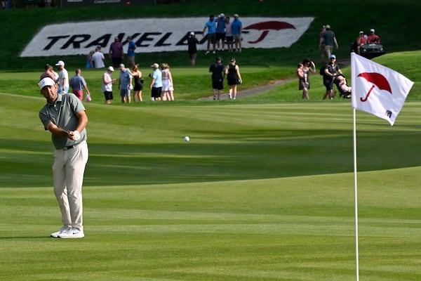 Scottie Scheffler hits his second shot on the 15th hole during the third round of the Travelers Championship golf tournament at TPC River Highlands, Saturday, June 21, 2025, in Cromwell, Conn. (AP Photo/Jessica Hill)