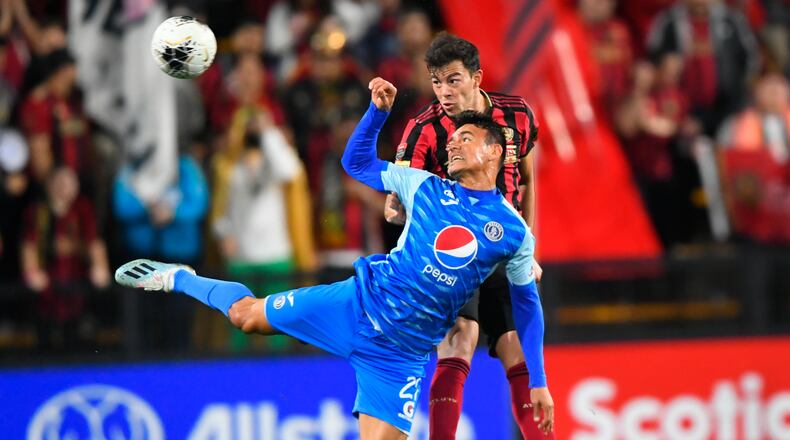 Roberto Aldana of the Motagua FC (front) and Fernando Meza battle for a header during the first half of soccer in the Scotiabank Concacaf Champions League, Tuesday, Feb. 25, 2020, in Kennesaw, Ga. (John Amis, Atlanta Journal Constitution)