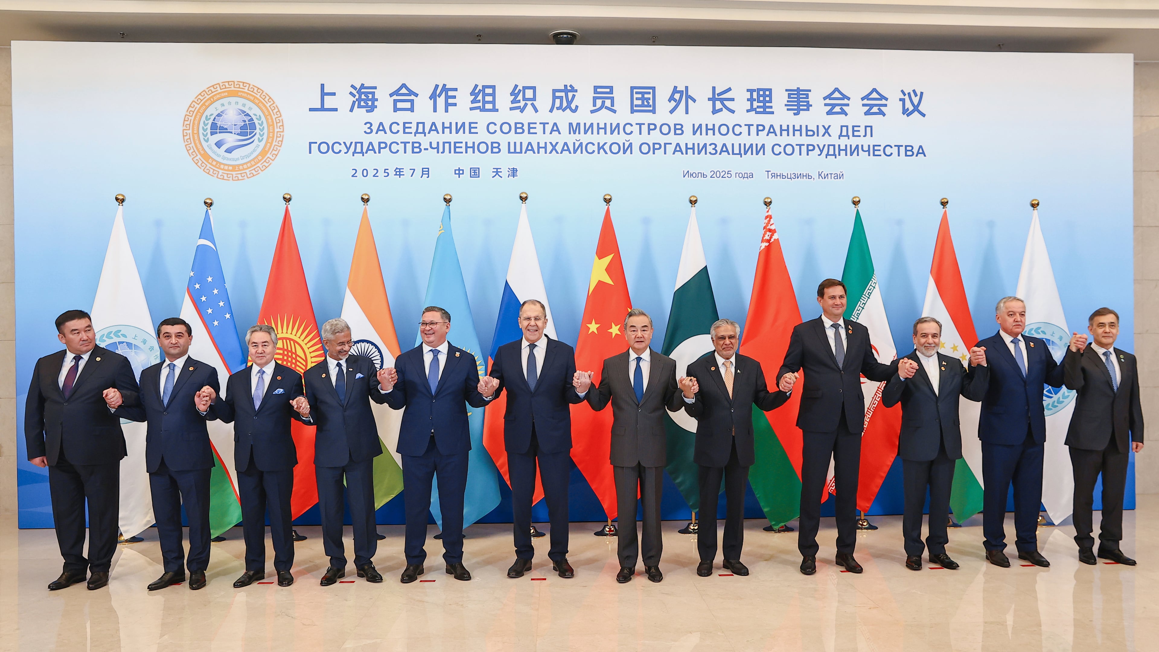 In this photo released by Russian Foreign Ministry Press Service on Tuesday, July 15, 2025, Russian Foreign Minister Sergey Lavrov, center left, and Chinese Foreign Minister Wang Yi, center right, pose for a photo with other officials during the meeting on the Council of Foreign Ministers of the Shanghai Cooperation Organization (SCO), in Tianjin, China. (Russian Foreign Ministry Press Service via AP)