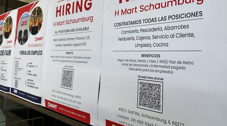 FILE - Hiring sign is displayed at a grocery store in Niles, Ill., Tuesday, Dec. 30, 2025. (AP Photo/Nam Y. Huh)