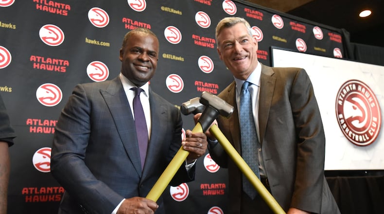 June 28, 2017 Atlanta - Mayor Kasim Reed (left) and Hawks principal owner Tony Ressler hold sledge hammers as they pose for members of the press during a press to release details of the $192.5 million update of Philips Arena on Wednesday, June 28, 2017. HYOSUB SHIN / HSHIN@AJC.COM