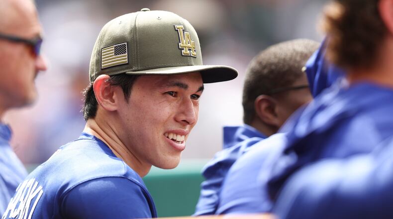 Los Angeles Dodgers pitcher Roki Sasaki reacts in the dugout during the eighth inning of a baseball game against the Los Angeles Angels, Sunday, May 17, 2026, in Anaheim, Calif. (AP Photo/Jessie Alcheh)