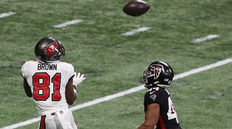 122020 Atlanta: Tampa Bay Buccaneers wide receiver Antonio Brown gets past Atlanta Falcons cornerback Tyler Hall for what proved to be the game-winning touchdown in the fourth quarter Sunday, Dec. 20, 2020, at Mercedes-Benz Stadium in Atlanta. The Bucs won 31-27. (Curtis Compton / Curtis.Compton@ajc.com)