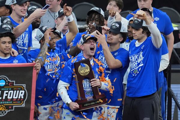 Florida head coach Todd Golden yells as he celebrates with is team after their win against Texas Tech in the Elite Eight of the NCAA college basketball tournament, Saturday, March 29, 2025, in San Francisco. (AP Photo/Marcio Jose Sanchez)