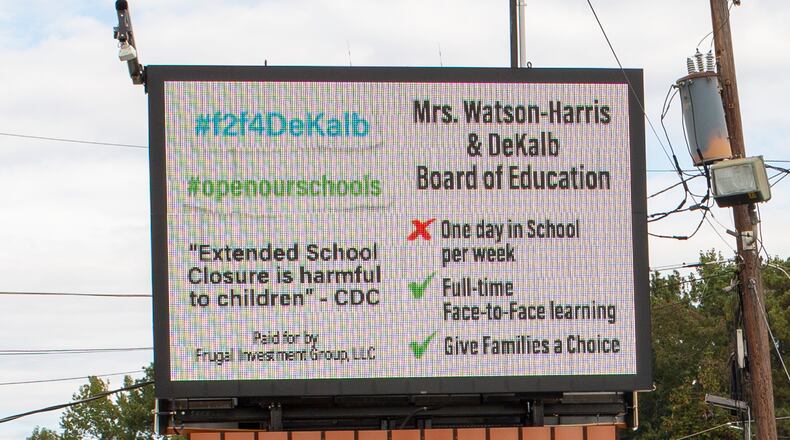 A billboard calling on DeKalb school distict leaders to offer a more robust in-person learning option, paid for by a group of DeKalb County parents, is seen on DeKalb Industrial Way in Decatur, Georgia, on Oct. 16, 2020. (Rebecca Wright for the Atlanta Journal-Constitution)