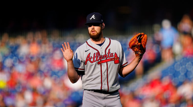 Atlanta Braves starting pitcher Ian Anderson reacts after giving up a single to Philadelphia Phillies' Nick Castellanos during the first inning of a baseball game, Thursday, June 30, 2022, in Philadelphia. (AP Photo/Matt Slocum)