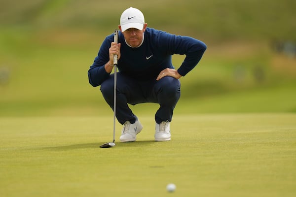 Rory McIlroy of Northern Ireland looks at his putt on the 7th green during the second round of the British Open golf championship at the Royal Portrush Golf Club, Northern Ireland, Friday, July 18, 2025. (AP Photo/Francisco Seco)