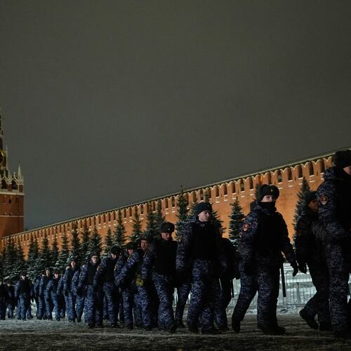 Police and the Rosguardia (National Guard) servicemen walk in the Red Square closed for celebrations on New Year's Eve in Moscow, Russia, Wednesday, Dec. 31, 2025. (AP Photo/Pavel Bednyakov)