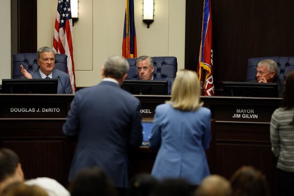 Alpharetta City Council member Douglas J. DeRito , right, debates with Tim Perry, managing director and chief investment officer at Jamestown, during a public meeting at the Alpharetta City Hall Council Chamber on Monday, August 24, 2026. The council considered a master plan amendment, rezoning, conditional uses, and variances to allow redevelopment of North Point Mall as a mixed-use development in hopes of securing an NHL franchise. (Miguel Martinez/AJC)