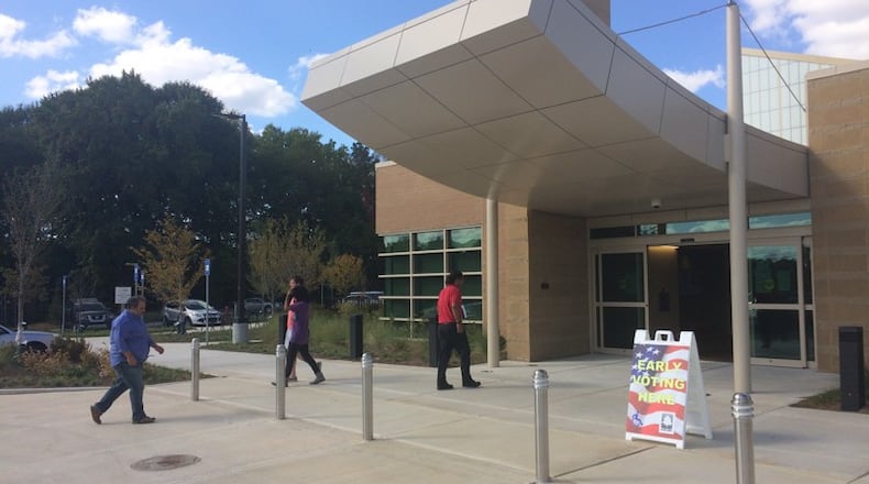 A steady stream of people came to the Southeast Atlanta Library to cast an early vote Monday afternoon. (BECCA GODWIN / BECCA.GODWIN@AJC.COM)