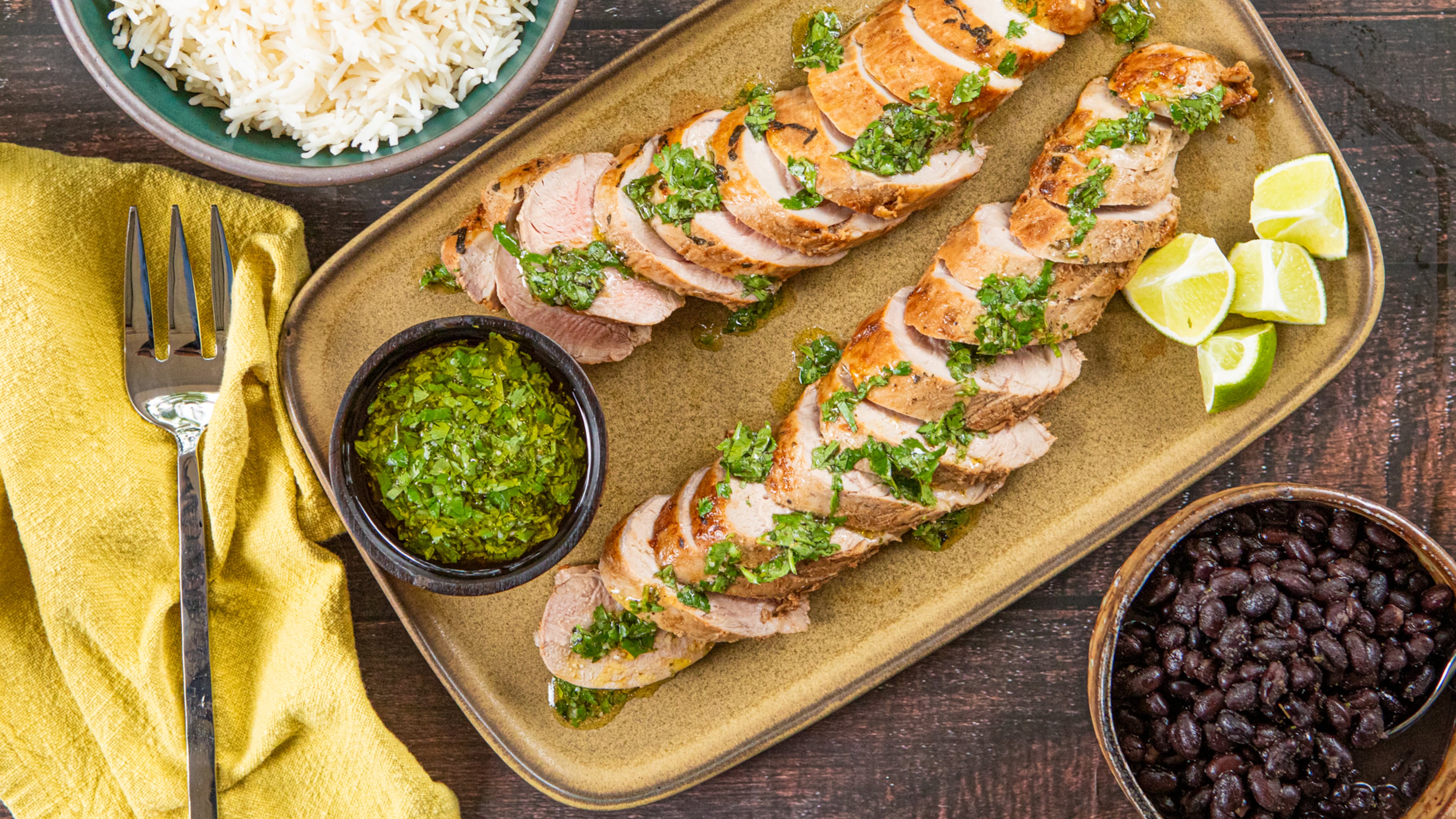 The bright herbs in this quick-cooking mojo-marinated pork tenderloin recipe offer a refreshing alternative to traditional Thanksgiving flavors. (Aaliyah Man for the AJC; food styling by Kate Williams)